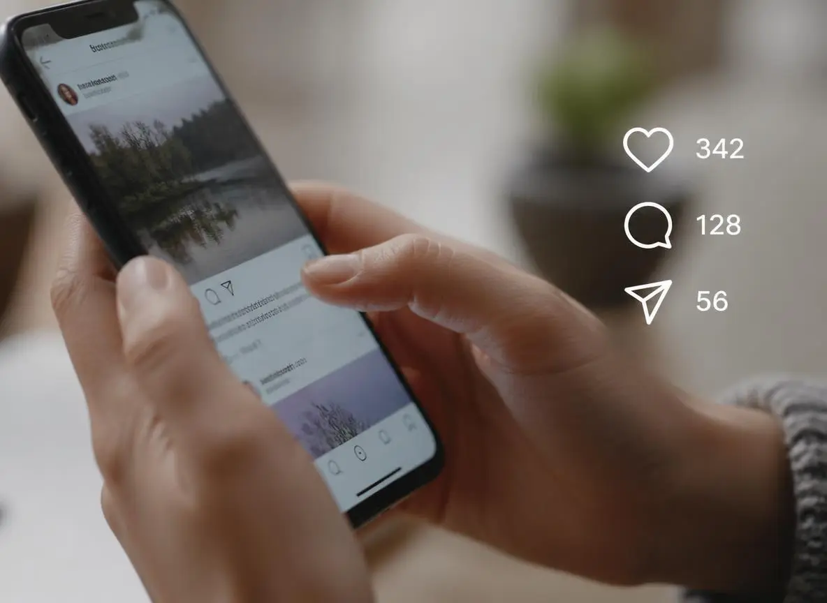 Person scrolling social media feed with engagement icons showing likes comments and shares